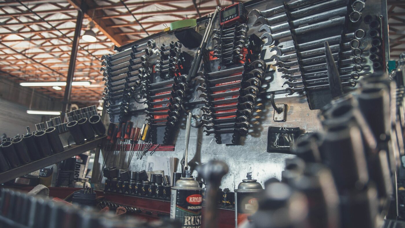 A wall of wrenches and sockets in an auto repair shop